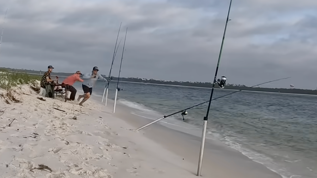 man sees his fishing pole getting dragged out to sea